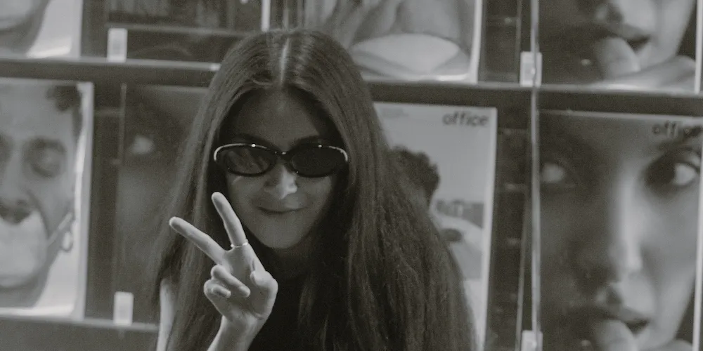 Image of Selena Aiyla posing with a peace sign. 