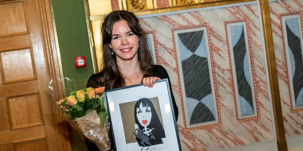 Woman holding picture in frame