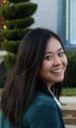 smiling woman looking over her shoulder
