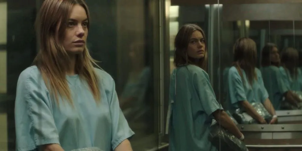 Still from 'Cosmic Dawn' - woman in room of mirrors
