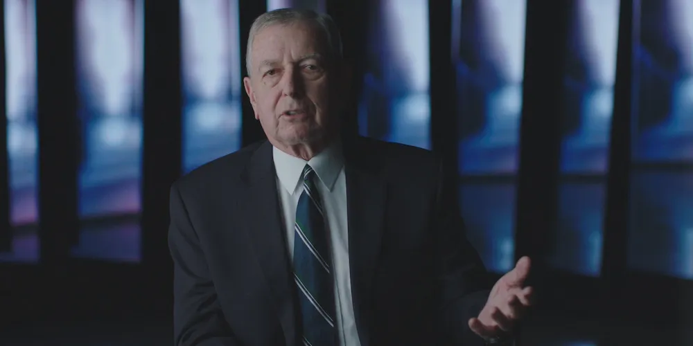 A white man in a suite