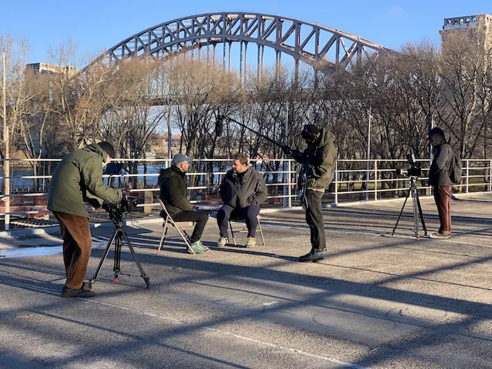 A glimpse behind the scenes of the crew filming 