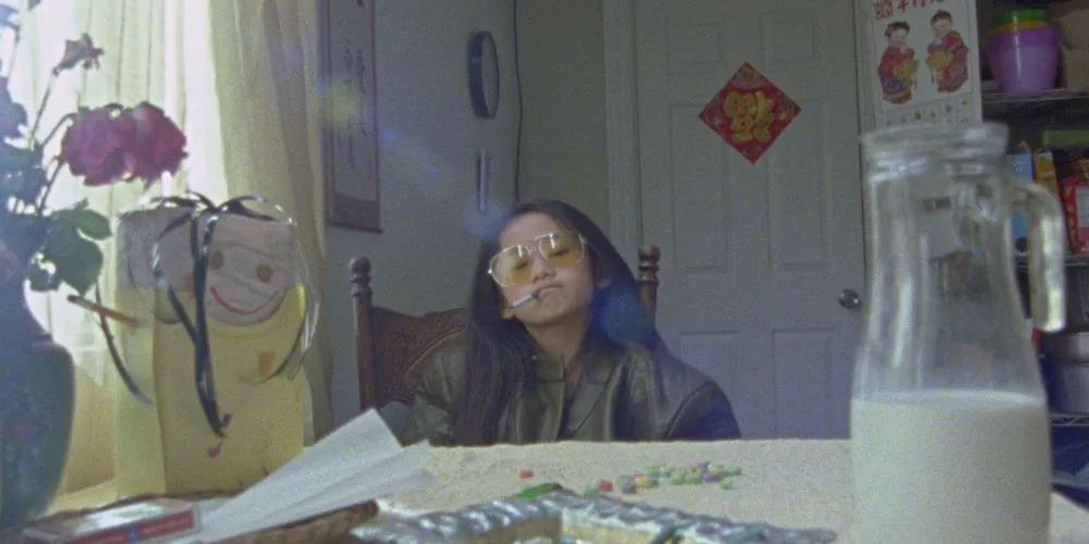Character in large framed sunglasses with a cigarette in mouth