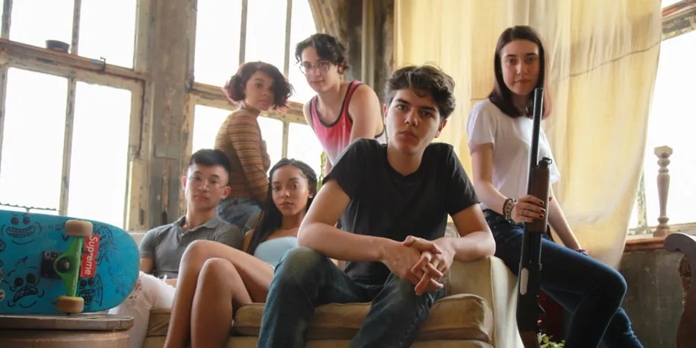 Group of young people posed around a couch