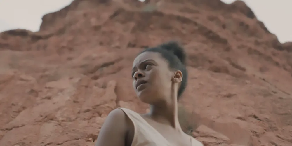 A woman in a desert landscape