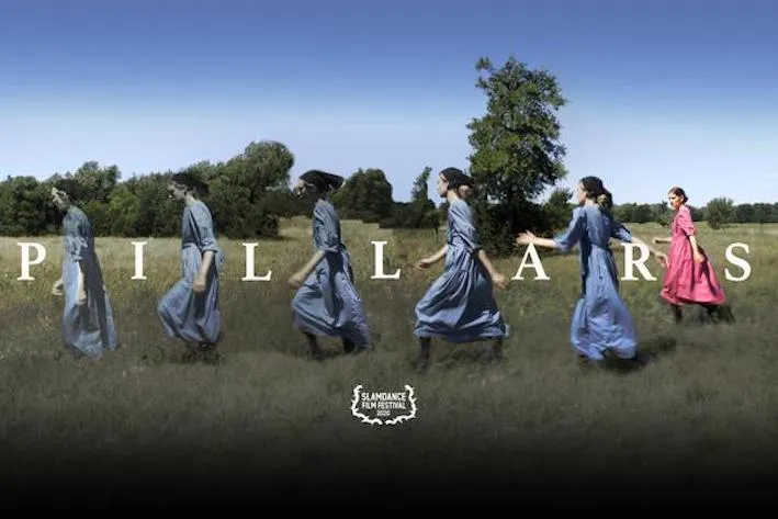 Women walking across a field.