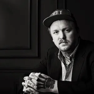 White man in a hat black and white portrait