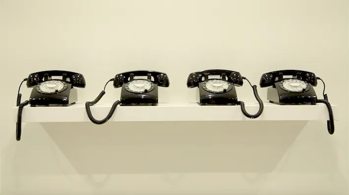 four rotary phones 