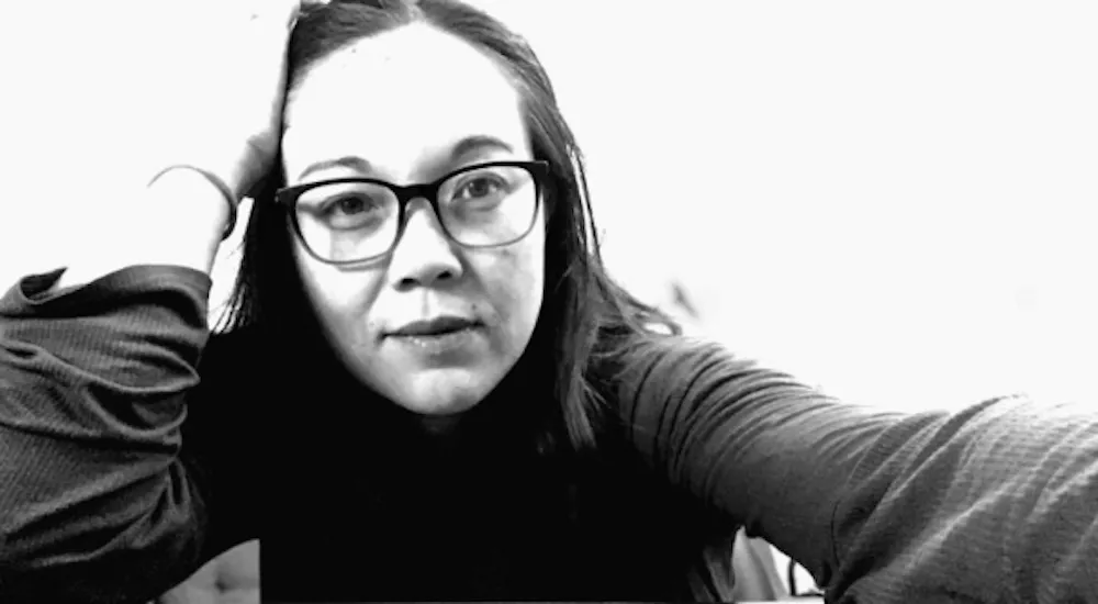 women with brown hair and glasses