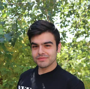 White man with dark hair, smiling