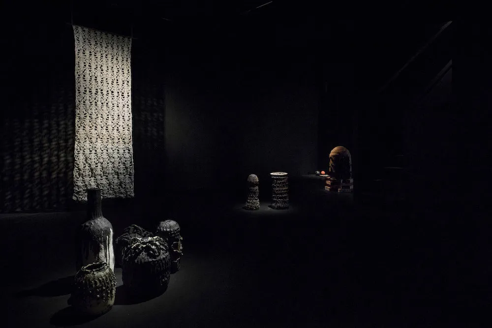 A dark studio scene with various items.