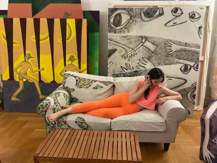 a woman laying on a couch 