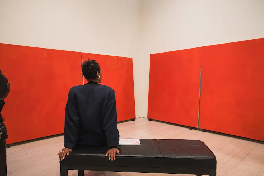 people look at art in a gallery