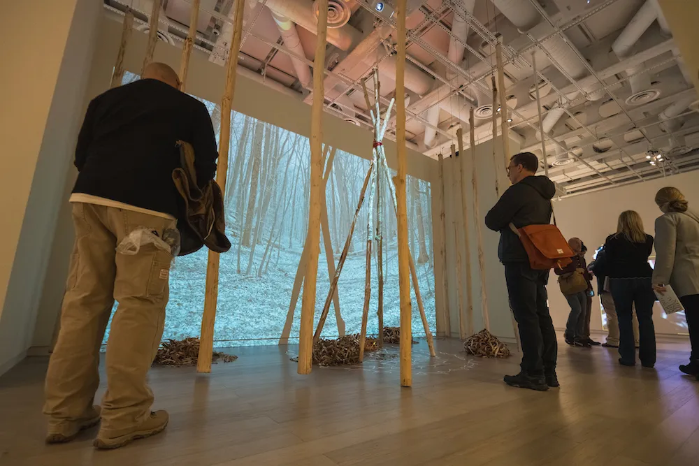 people look at art in a gallery