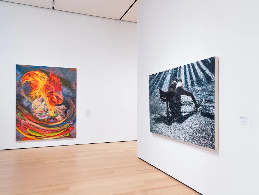 Artworks displayed on white gallery walls. 