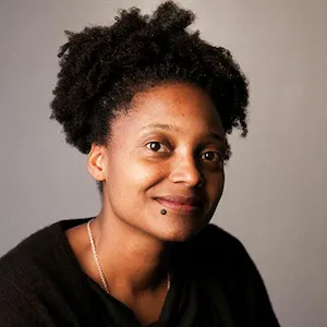A black woman smiling