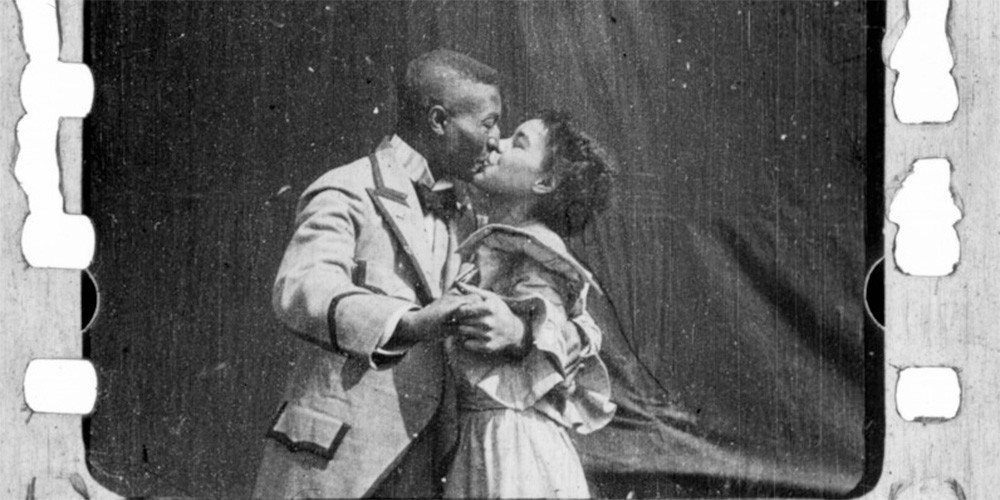 african american couple kissing in old film reel