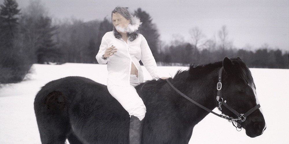 Woman on horse, smoking