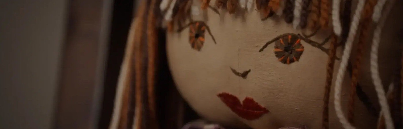 Close up of a rag doll's face. 