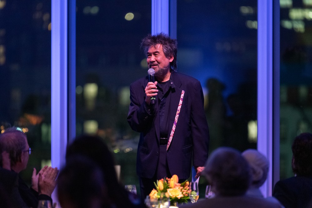 a man speaks into a microphone