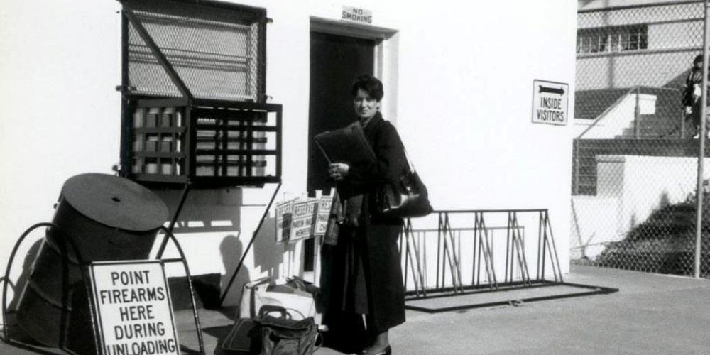 Woman outside industrial building