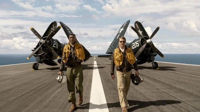 Still from 'Devotion' - two fighter pilots walk down the runway of an airplane carrier