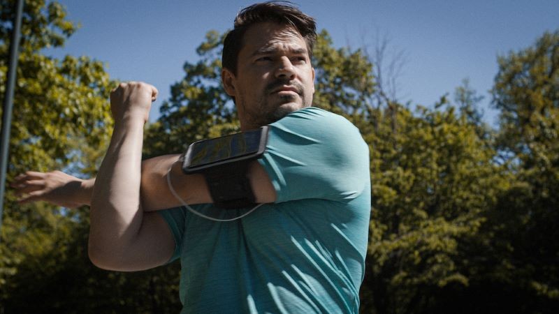 still from 'The Fastest Man' man stretching