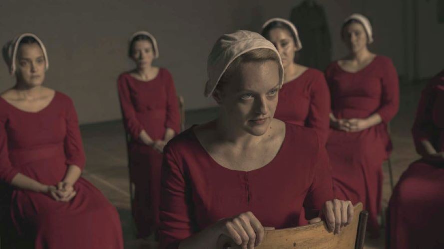 Still from 'The Handmaid's Tale' women in red dresses and white hoods