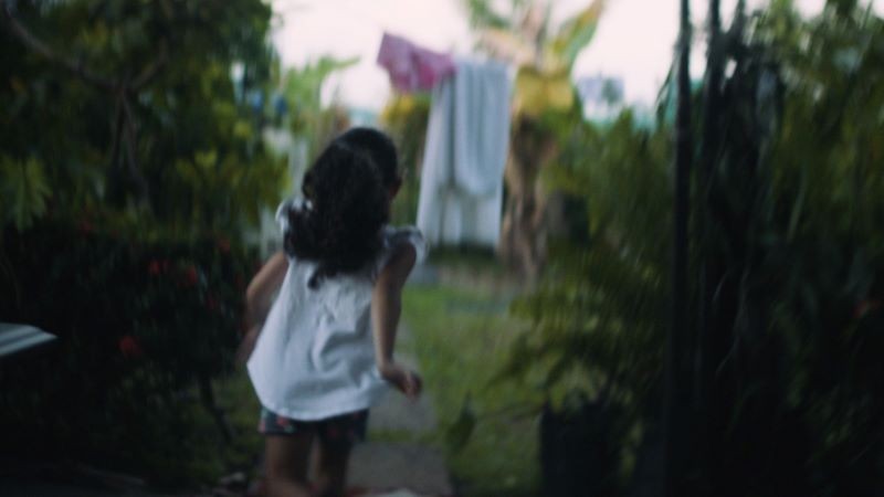 Still from Hector's Woman of child running through an outdoor setting