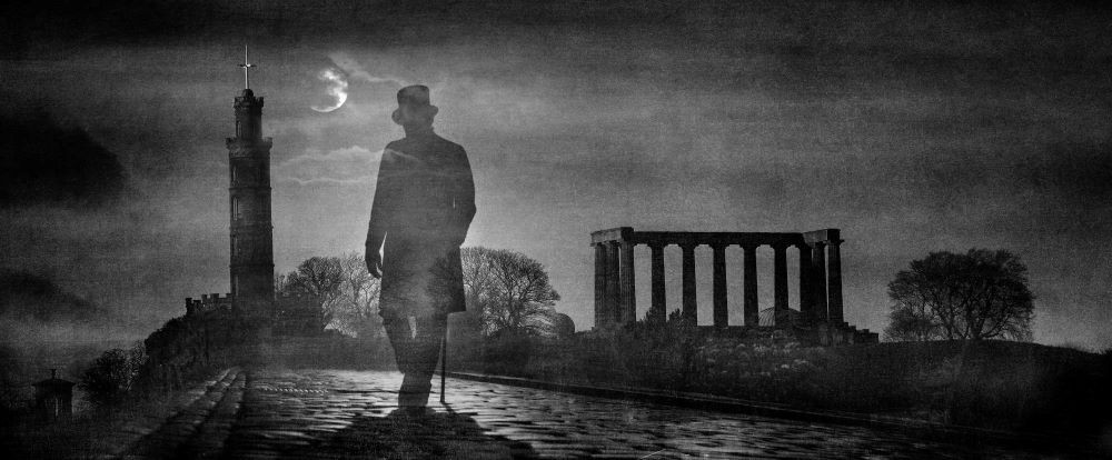 man with top hat and cane walking through ruins at night
