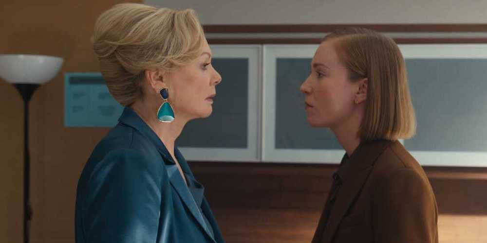 Two women stare at each other. 