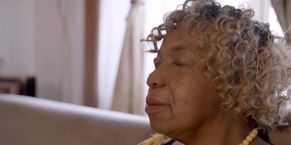 Woman closes her eyes. 