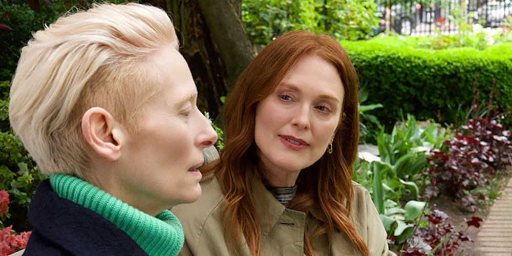 Two woman talking in a park. 