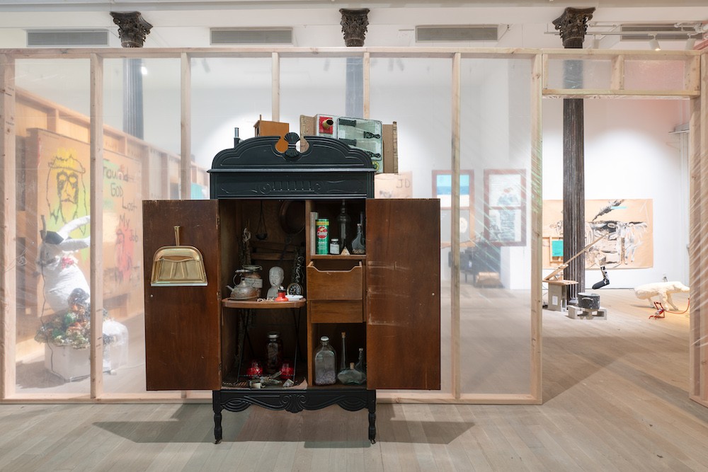Char Jeré: Zoo or an Orchestra. Installation view, Artists Space, 2023. Image courtesy Artists Space, New York. Photo: Filip Wolak. Cabinet filled with bottles