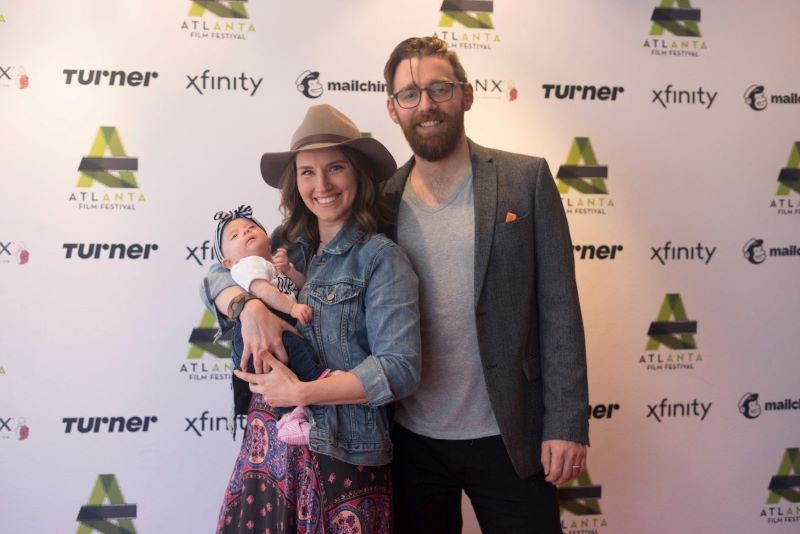 Matt Torney at the premiere of wife, Amber McGinnis' first feature film at the Atlanta Film Festival with their daughter, Isla May.