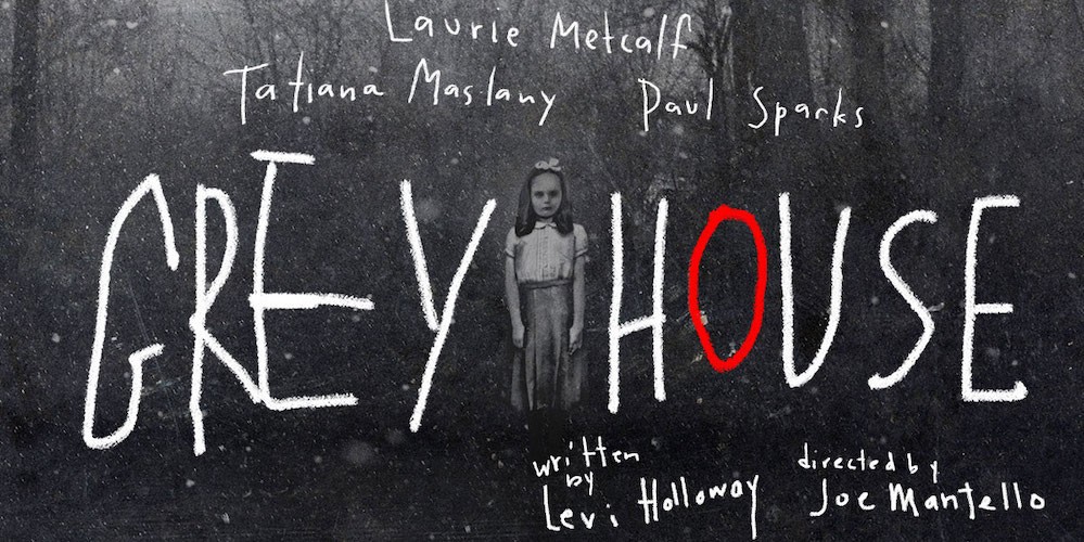 Grey House poster - a ghostly looking young girl stands alone in the woods. 