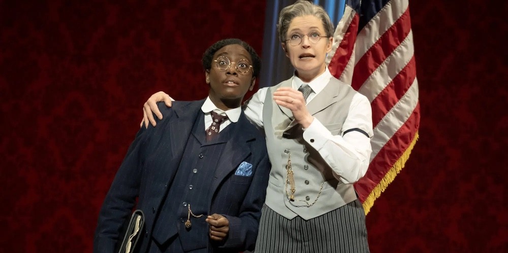 Two women actors dressed as Dudley Malone and President Woodrow Wilson.