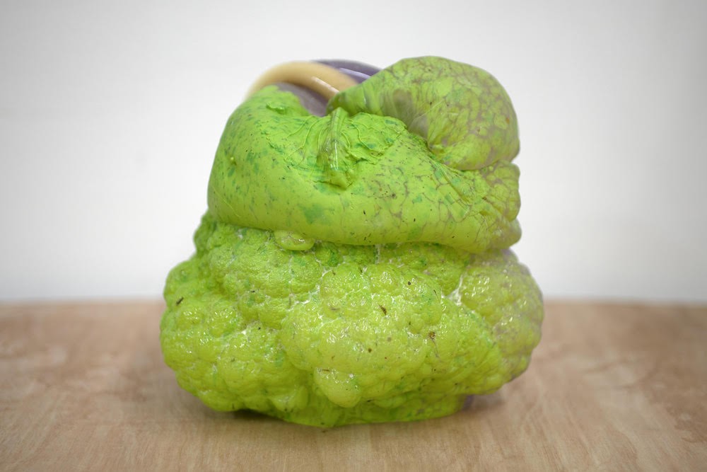 Anna-Ting Möller '23, 'Fantasy of the Fabrication,' (8x8x9 inches, hand blown glass, lost mold technique, 2022) Green sculpture