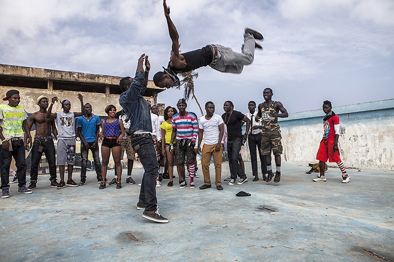 Professor Adama Delphine Fawundu '18, Freestyle, Accra Ghana two people performing in front of a small crowd