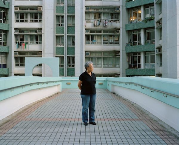 man standing on an elevated walk way
