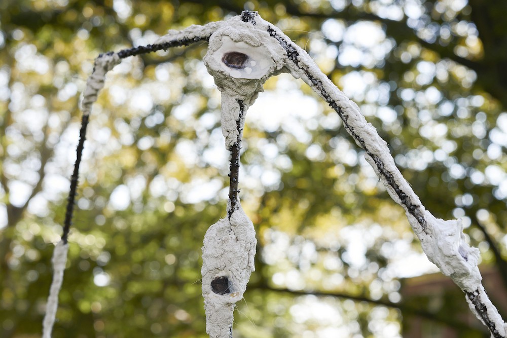 Detail of 'Shoals II,' a metal structure covered by welding beads, lime mortar with crushed and whole "oyster eyes.”