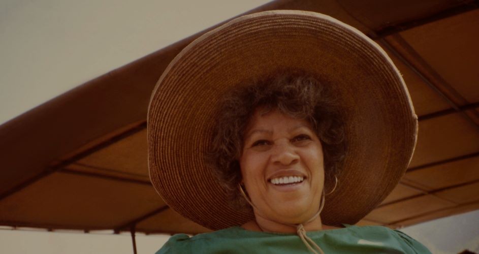 woman in sunhat smiling