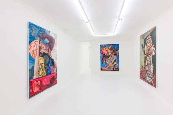 three paintings in a gallery