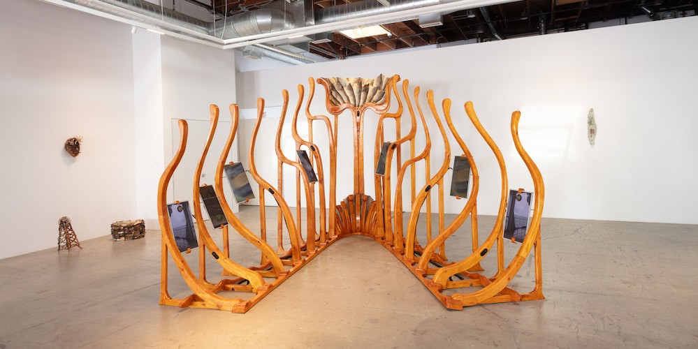 Sasha Fishman '24, 'I want to be wet,' (11’ x 12’ x 9’; 05:30; Douglas Fir, shellac, beer, salt, dried fish collagen, marshmallow, salmon eggs, glycerin, salmon scales, tanned salmon skin, egg yolk, Dawn, monitors, media players, speakers, beeswax thread; 7 channel video, color, sound; 2024) Fabrication support: Kenny Sale, Carol Yuan, Lolo Dederer and Ray Barsante. Sourcing: Salmon skin donated from Acme. Filmed by Kenny Sale + Matthew Genecov + Sasha Fishman. Sound by Miles Scharff + Sasha Fishman. AV support: Pierre Briet. Installation support: Ian Riccardo, Jorjay Mujica, Sam Shoemaker, Lera Niemackl. Sasha Fishman '24, 'I want to be wet,'