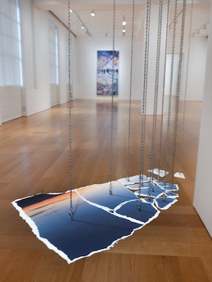 Art installation with chains and paintings. 
