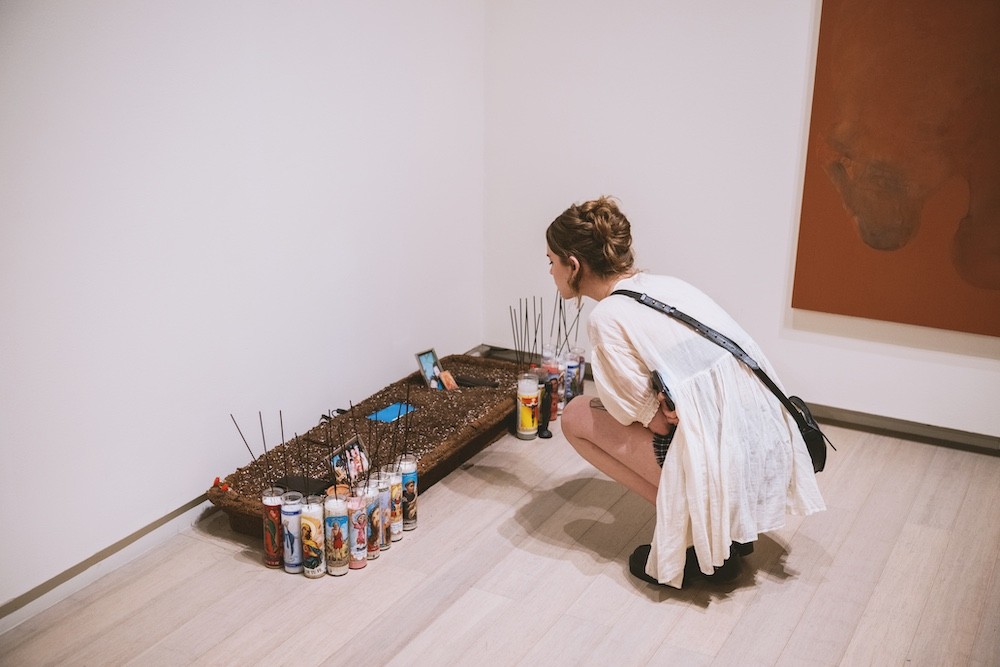 Person looking an at art installation.