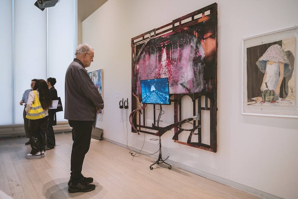 People view art work.