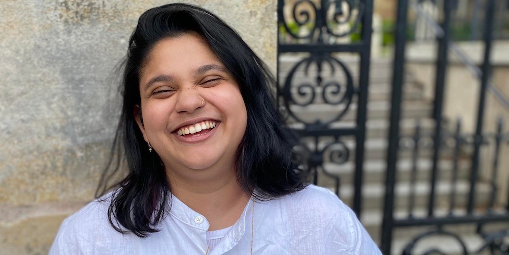 Headshot of Padya Paramita, a woman laughing
