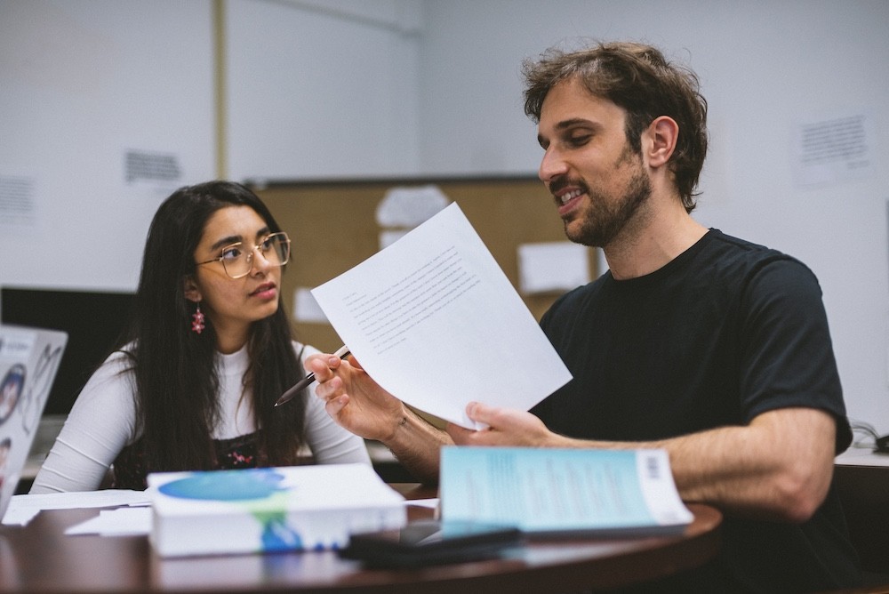 two students in a writing workshop