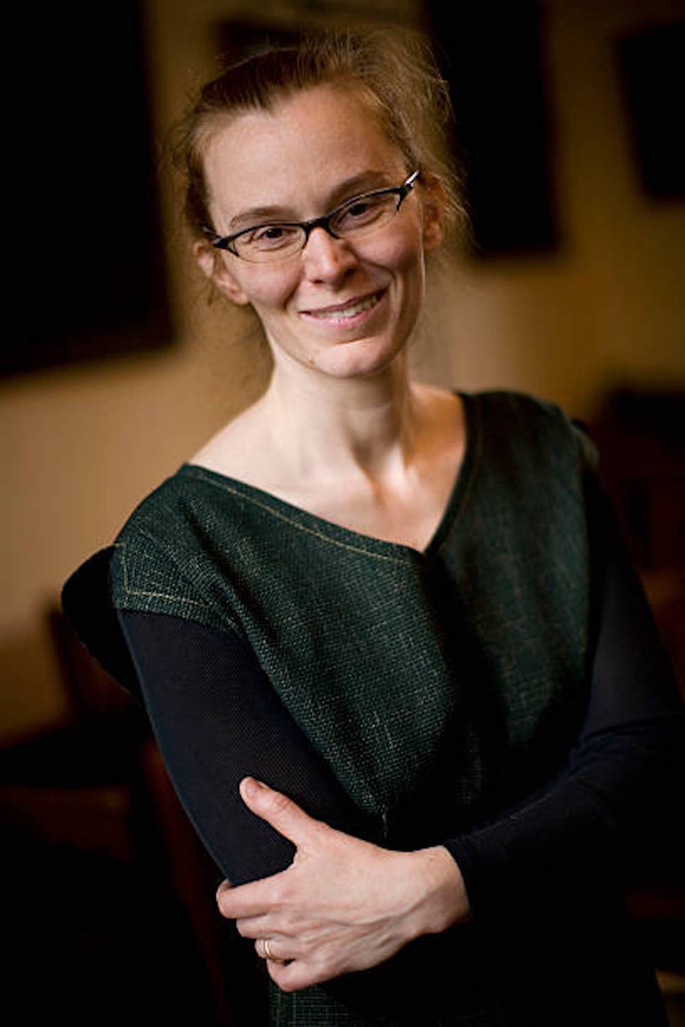 white person with glasses, smiling